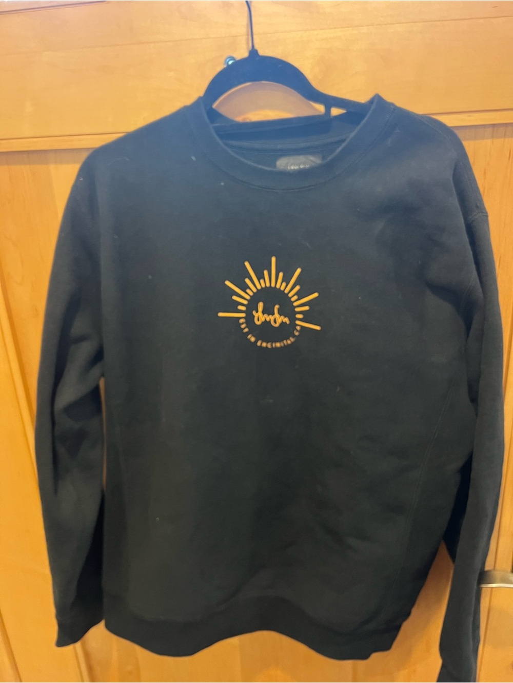 Black Crewneck Sweatshirt with Gold Sun Graphic